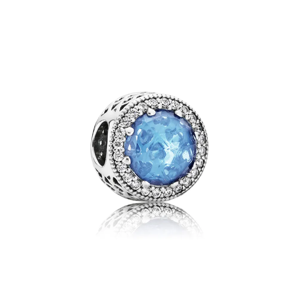 Abstract silver charm with sky blue crystal and clear cubic zirc