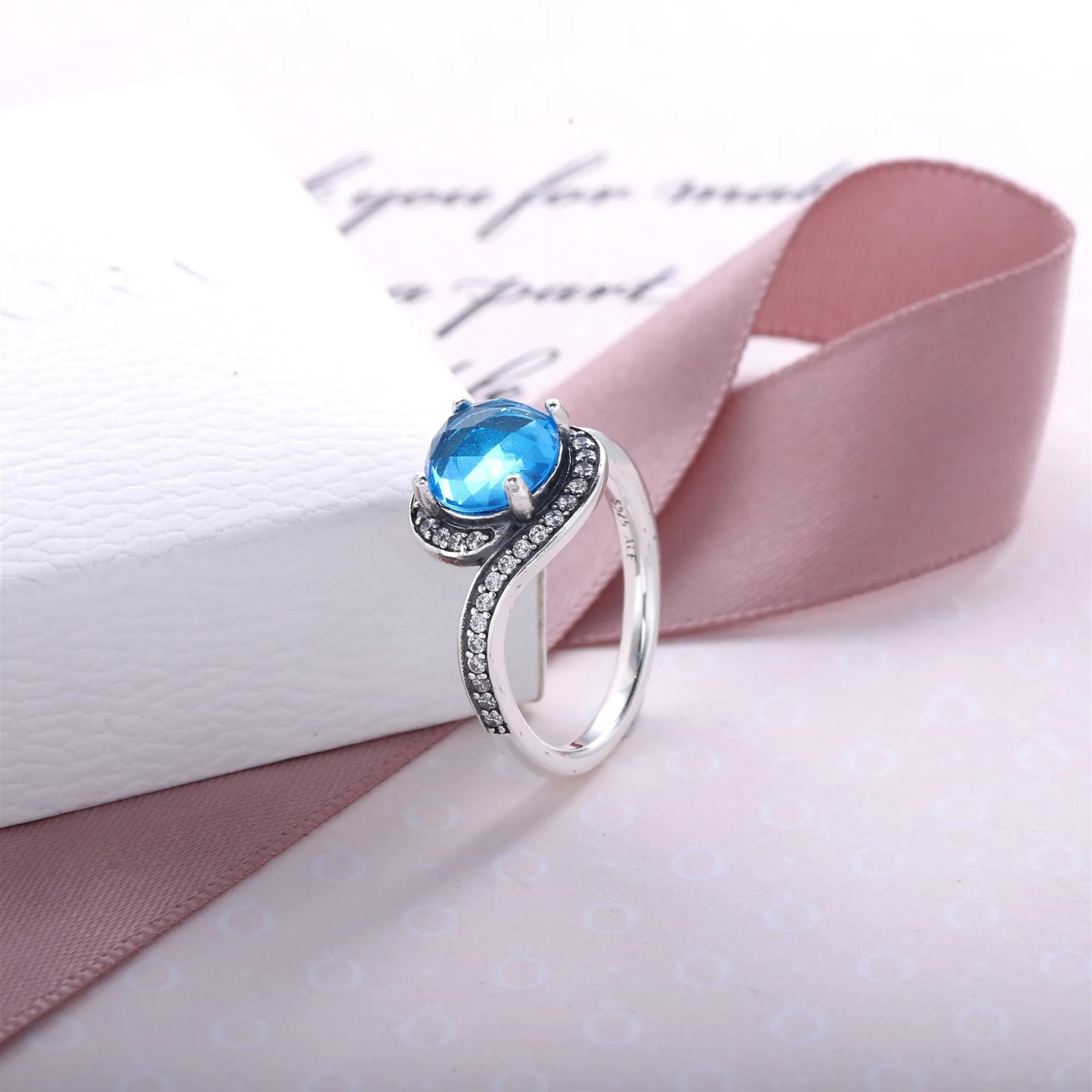 Silver ring with sky blue crystal and clear cubic zirconia - 190